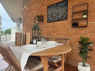 a table with plates on it on a patio at Silvestri206 in Rome