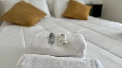 a bedroom with a bed with towels on it at Civico7 - Luxury Apartment in Rome