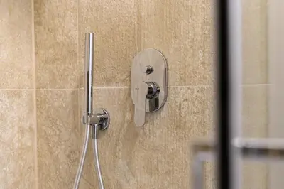 a bathroom with a shower with a toilet and a sink at Civico7 - Luxury Apartment in Rome