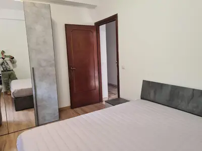 a person taking a picture of a bedroom with a bed at Mother House in Rome