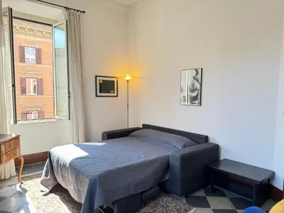 a bedroom with a bed and a window at Casa Angeli 2 in Rome