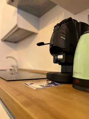 a coffee machine sitting on top of a counter at Vatican Dimora Apartments in Rome