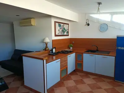 a kitchen with a sink and a counter top at Attico GianLuce in Rome