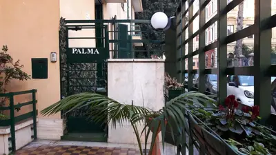 a entrance to a building with a green door at Palma in Rome