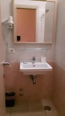 a bathroom with a sink and a mirror at Palma in Rome