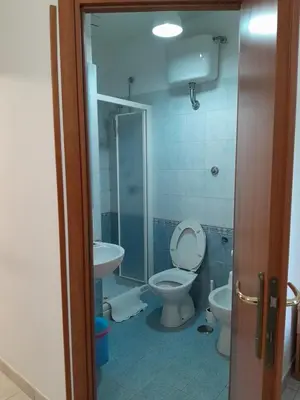 a bathroom with a toilet and a sink at Palma in Rome
