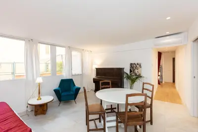 a living room with a table and chairs at Casa Donna Olimpia Pamphilj in Rome