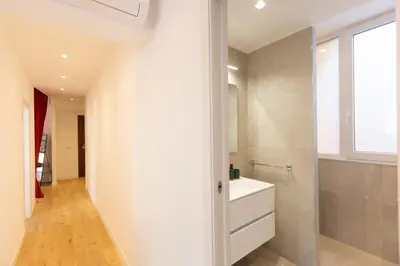 a bathroom with a white sink and a shower at Casa Donna Olimpia Pamphilj in Rome