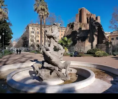a statue of a water fountain in front of a building at Casa Di Camilla in Rome