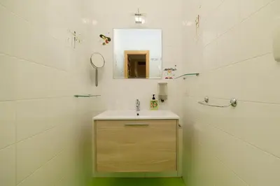a bathroom with a sink and a mirror at Casa Di Camilla in Rome