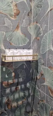 a wall with a wallpaper with leaves on it at Roma Suite Style in Rome