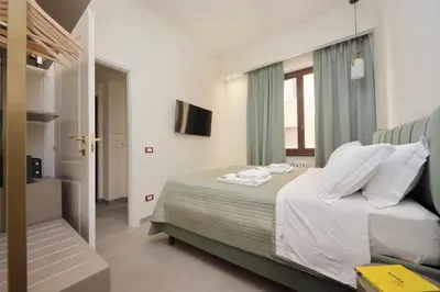 a bedroom with a bed and a window at Roma Suite Style in Rome