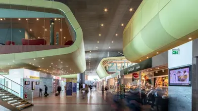 a shopping mall with people walking through it at Casa De Santis in Rome