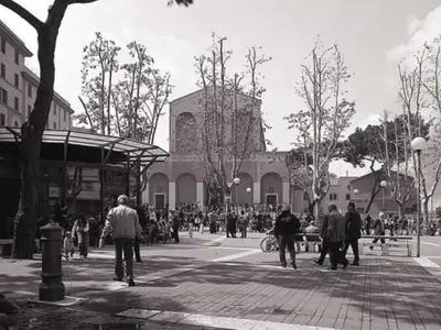 a group of people walking down a city street at Casa De Santis in Rome