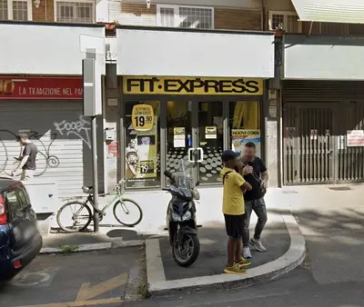 a group of people standing in front of a store at Casa De Santis in Rome