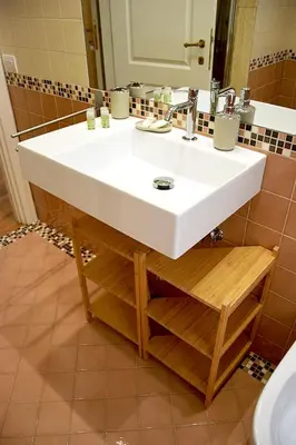 a bathroom with a white sink and a mirror at B&B CasaBentivoglio in Rome