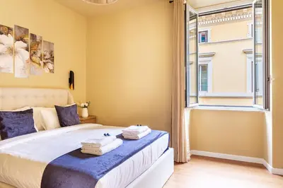 a bedroom with a bed and a window at iFlat Warm & Welcoming Little Gem in Rione Monti in Rome