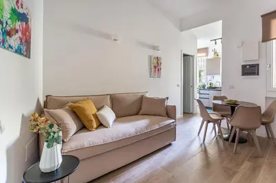 a living room with a couch and a table at iFlat Stylish New Flat Steps from the Vatican in Rome