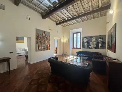 a living room with couches and a glass table at La Dolce Vita in the Ancient Rome in Rome