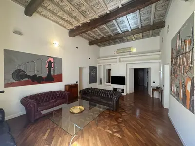 a living room with two couches and a television at La Dolce Vita in the Ancient Rome in Rome