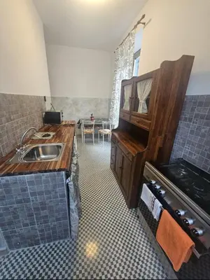 a kitchen with a sink and a counter top at Roma centro little house of testaccio in Rome