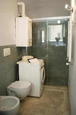 a bathroom with a toilet and a shower at Appartamento Piazza Farnese in Rome