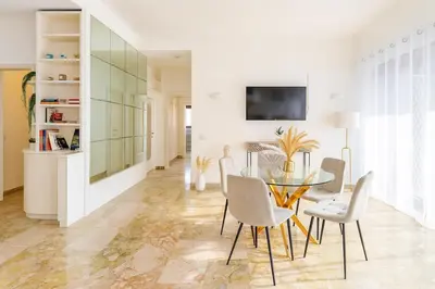 a dining room with a glass table and chairs at 85mq of Vintage Luxury-Near Vatican City WIFI AC in Rome