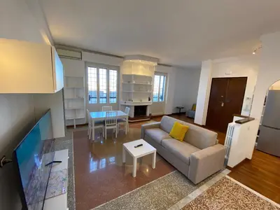 a living room with a couch and a table at The 7th in Rome