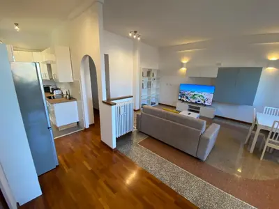 a living room with a couch and a television at The 7th in Rome