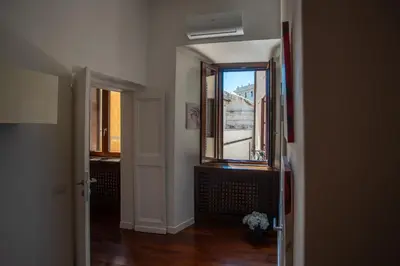 a hallway with a window and a view of a building at Pgrhome Campitelli in Rome