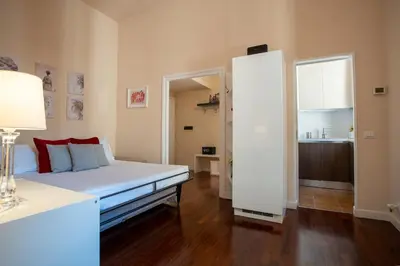 a bedroom with a bed and a large mirror at Pgrhome Campitelli in Rome