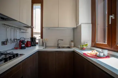 a kitchen with a sink and a counter top at Pgrhome Campitelli in Rome