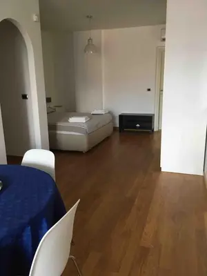a bedroom with a bed and a table and chairs at magic portaportese in Rome