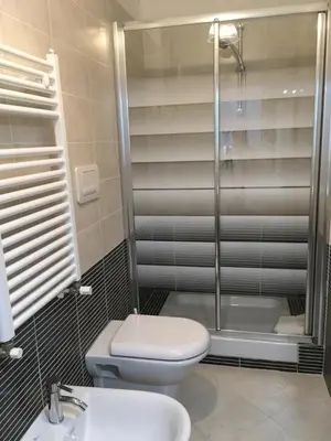 a bathroom with a shower and a toilet and a sink at magic portaportese in Rome