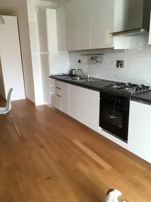 a kitchen with a dog laying on the floor at magic portaportese in Rome