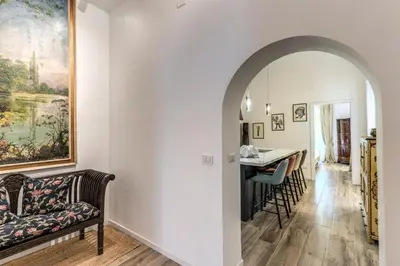 a living room with a couch and a table at BoHo Studio & Terrace in Rome