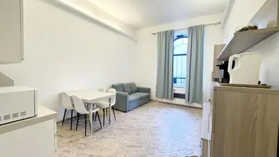 a living room with a couch and a table at Foro Romano Apartments C in Rome