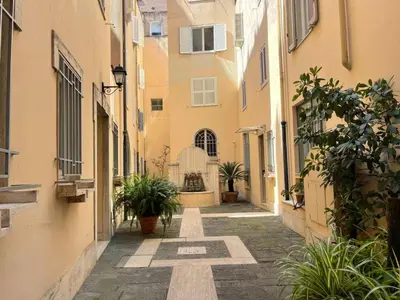 an alley with potted plants and buildings at Foro Romano Apartments C in Rome