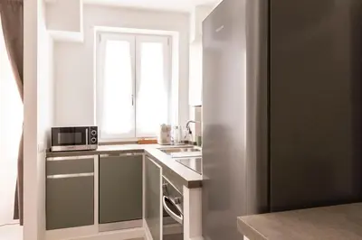 a small kitchen with a sink and a microwave at Comfort Suite Balduina - Rome in Rome
