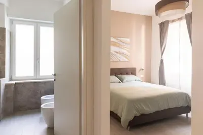 a bedroom with a bed and a window at Comfort Suite Balduina - Rome in Rome