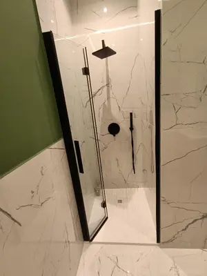 a shower with a glass door in a bathroom at Luxury Rome Vatican's Garden in Rome