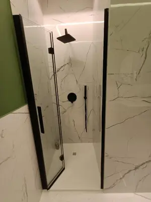 a shower with a glass door in a bathroom at Luxury Rome Vatican's Garden in Rome