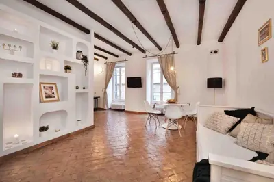 a living room with a couch and a table at Gianicolo Maison nel cuore di Roma in Rome