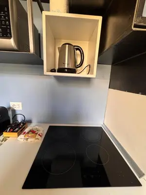 a tea kettle is sitting inside of a microwave at Residenza Labicana few steps from Colosseum in Rome