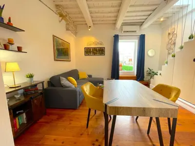 a living room with a table and a couch at My Beauty Nest In The Historical Centre in Rome