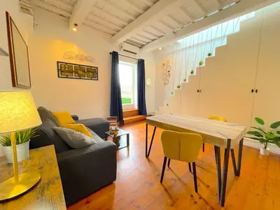 a living room with a couch and a table at My Beauty Nest In The Historical Centre in Rome