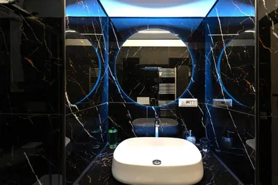 a bathroom with a sink and a toilet and a mirror at BOHEMIAN PIGNETO RHOME - 2bdr 2bath - Metro Pigneto connecting in 8 minutes to Colosseum - Near Termini Railway station, La Sapienza Uni, Policlinico Umberto I hospital - Family friendly with baby equipment - Vibrant area - Guest care in 4 languages in Rome