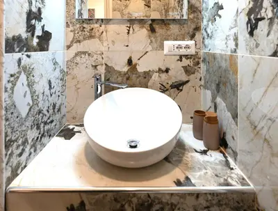 a bathroom with a toilet and a shower at BOHEMIAN PIGNETO RHOME - 2bdr 2bath - Metro Pigneto connecting in 8 minutes to Colosseum - Near Termini Railway station, La Sapienza Uni, Policlinico Umberto I hospital - Family friendly with baby equipment - Vibrant area - Guest care in 4 languages in Rome