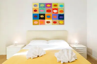 a bedroom with a bed with two towels on it at Al Vaticano Roma Suite in Rome