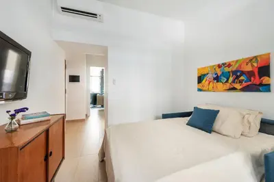 a bedroom with a bed and a flat screen tv at Alma Luxury Apartment Elegant 1BR quartiere africano Self Check in Metro B in Rome